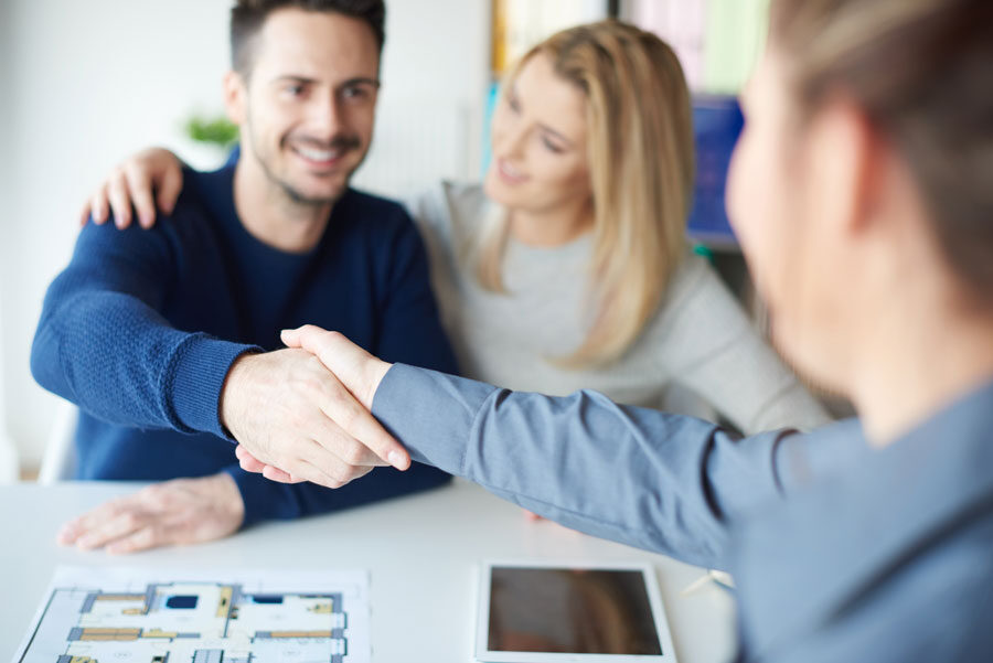 man shaking hands with real estate agent KZCG